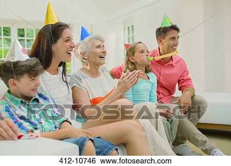 Family celebrating birthday together View Large Photo Image Stock Photograph - Family celebrating birthday together. Fotosearch