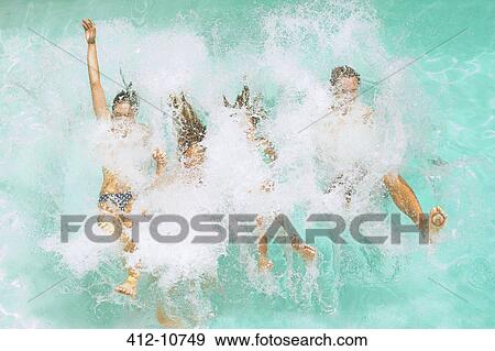 Stock Photo - Family jumping into swimming pool. Fotosearch