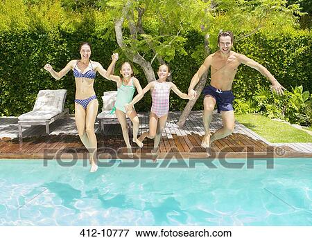 Stock Photo - Family jumping into swimming pool. Fotosearch