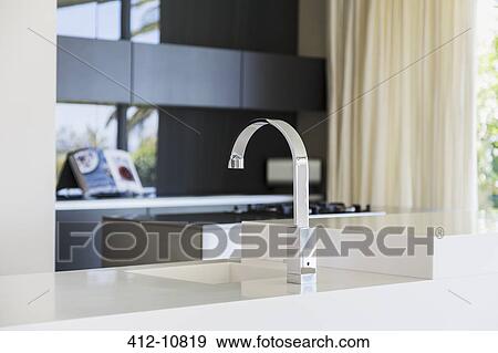Faucet and sink in modern kitchen View Large Photo Image Stock Photo - Faucet and sink in modern kitchen. Fotosearch