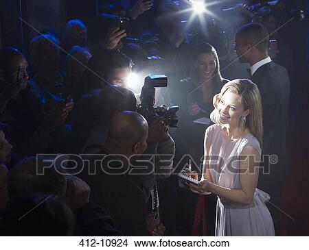 Picture - Female celebrity signing autographs. Fotosearch