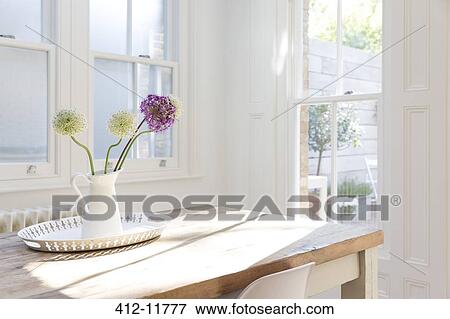 Flowers in vase on wooden table View Large Photo Image Stock Photo - Flowers in vase on wooden table. Fotosearch