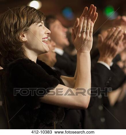 Happy woman clapping in theater audience View Large Photo Image Stock Image - Happy woman clapping in theater audience. Fotosearch