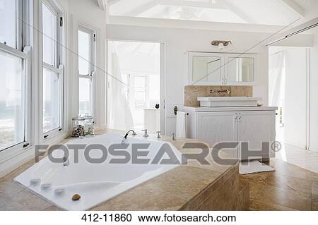 Jacuzzi tub in luxury bathroom View Large Photo Image Stock Image - Jacuzzi tub in luxury bathroom. Fotosearch