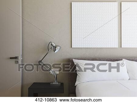 Lamp and wall art in modern bedroom View Large Photo Image Stock Image - Lamp and wall art in modern bedroom. Fotosearch