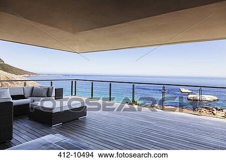 Picture - Luxury balcony overlooking ocean. Fotosearch