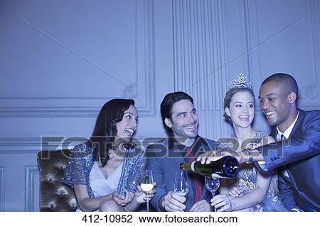 Man pouring champagne for friends View Large Photo Image Stock Image - Man pouring champagne for friends. Fotosearch