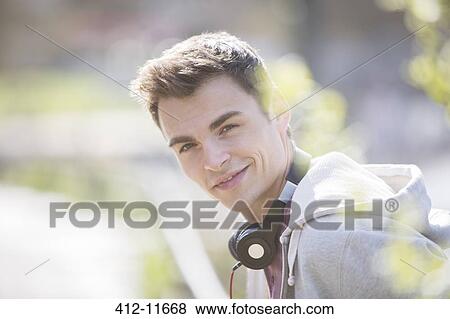 Man wearing headphones outdoors View Large Photo Image Stock Photo - Man wearing headphones outdoors. Fotosearch