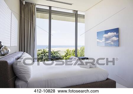 Modern bedroom with ocean view View Large Photo Image Stock Photo - Modern bedroom with ocean view. Fotosearch