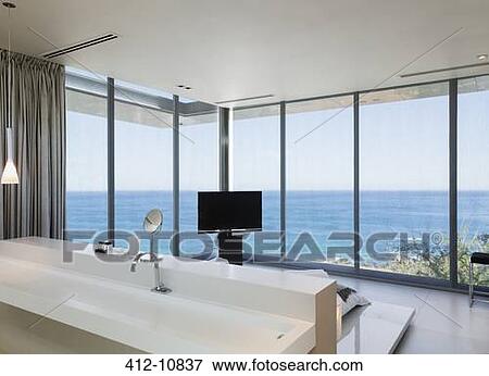 Modern bedroom with ocean view View Large Photo Image Stock Photo - Modern bedroom with ocean view. Fotosearch