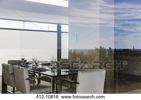 Modern dining room through window View Large Photo Image Stock Photograph - Modern dining room through window. Fotosearch