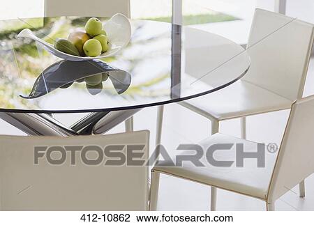Stock Image - Modern dining table and chairs. Fotosearch