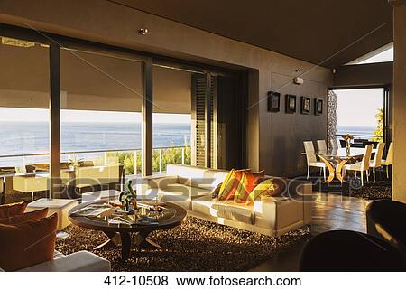 Modern living room overlooking ocean View Large Photo Image Stock Photo - Modern living room overlooking ocean. Fotosearch