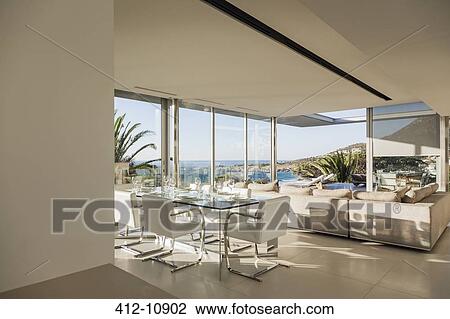Stock Image - Modern open floor plan overlooking ocean. Fotosearch