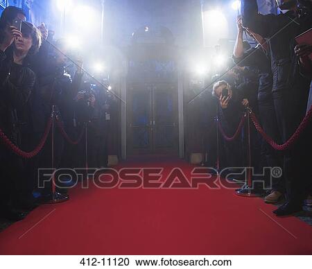 Paparazzi using flash photography along red carpet View Large Photo Image Stock Image - Paparazzi using flash photography along red carpet. Fotosearch