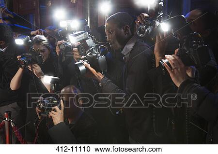 Paparazzi using flash photography at red carpet event View Large Photo Image Stock Image - Paparazzi using flash photography at red carpet event. Fotosearch