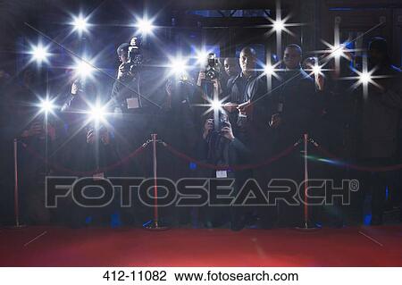 Paparazzi using flash photography behind rope on red carpet View Large Photo Image Stock Image - Paparazzi using flash photography behind rope on red carpet. Fotosearch