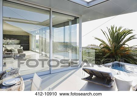 Patio and swimming pool of modern house View Large Photo Image Stock Image - Patio and swimming pool of modern house. Fotosearch