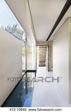 Stock Photography - Pool and corridor of modern house. Fotosearch