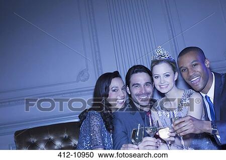 Portrait of happy friends toasting champagne flutes View Large Photo Image Stock Image - Portrait of happy friends toasting champagne flutes. Fotosearch