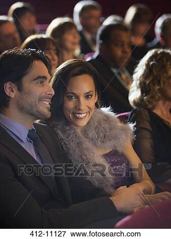 Portrait of smiling woman in theater audience View Large Photo Image Stock Photo - Portrait of smiling woman in theater audience. Fotosearch