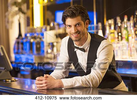 Portrait of well dressed bartender leaning on bar View Large Photo Image Stock Photography - Portrait of well dressed bartender leaning on bar. Fotosearch