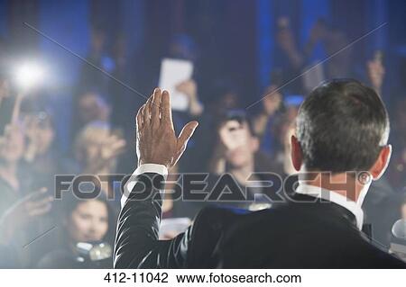 Rear view of male celebrity waving to paparazzi View Large Photo Image Stock Image - Rear view of male celebrity waving to paparazzi. Fotosearch