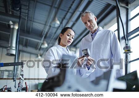 Scientists working in laboratory View Large Photo Image Picture - Scientists working in laboratory. Fotosearch