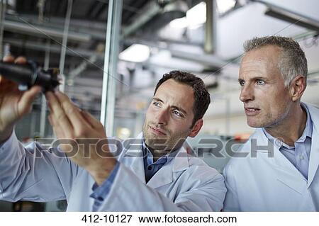 Scientists working in laboratory View Large Photo Image Stock Photo - Scientists working in laboratory. Fotosearch
