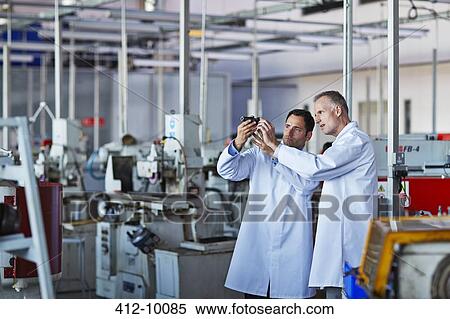 Scientists working in laboratory View Large Photo Image Stock Photography - Scientists working in laboratory. Fotosearch