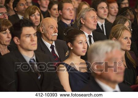 Stock Image - Serious theater audience. Fotosearch