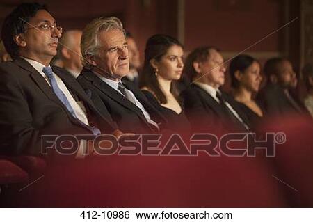 Serious theater audience View Large Photo Image Stock Photograph - Serious theater audience. Fotosearch