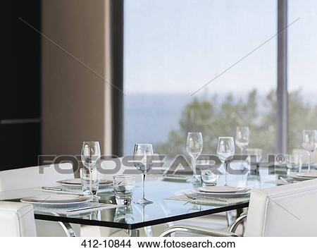 Set table in modern dining room View Large Photo Image Picture - Set table in modern dining room. Fotosearch