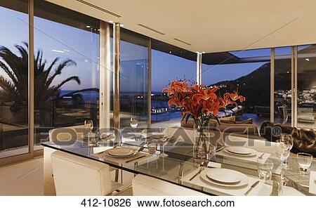 Stock Photograph - Set table in modern dining room. Fotosearch