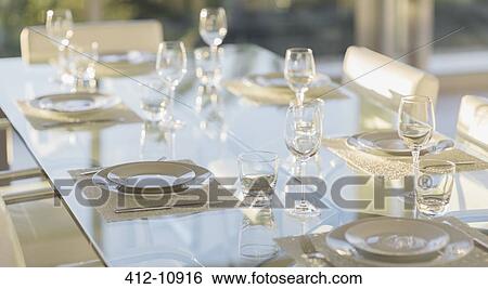 Set table in modern dining room View Large Photo Image Stock Photograph - Set table in modern dining room. Fotosearch