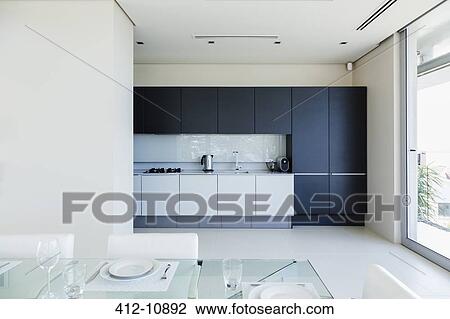 Set table in modern kitchen View Large Photo Image Stock Image - Set table in modern kitchen. Fotosearch