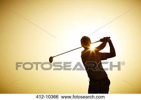 Silhouette of man swinging golf club View Large Photo Image Stock Photograph - Silhouette of man swinging golf club. Fotosearch