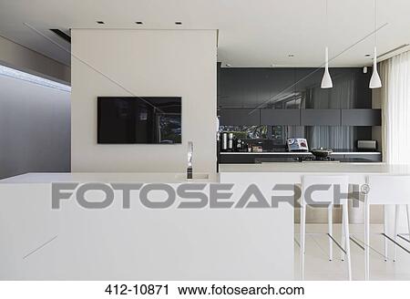 Sink and breakfast bar in modern kitchen View Large Photo Image Stock Image - Sink and breakfast bar in modern kitchen. Fotosearch