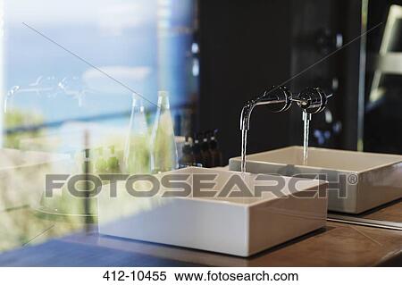 Stock Photography - Sink and mirror in modern bathroom. Fotosearch