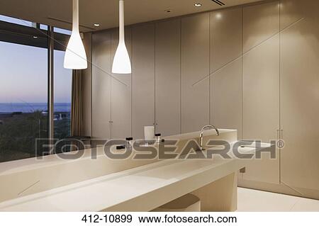 Sink and pendant lights in modern bathroom View Large Photo Image Stock Photo - Sink and pendant lights in modern bathroom. Fotosearch