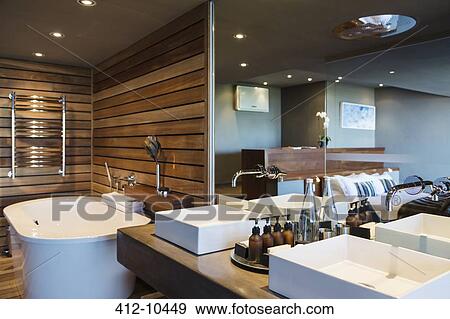 Sinks and bathtub in modern bathroom View Large Photo Image Stock Photo - Sinks and bathtub in modern bathroom. Fotosearch
