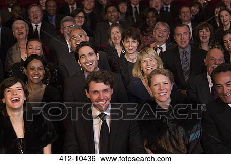 Stock Photograph - Smiling theater audience. Fotosearch