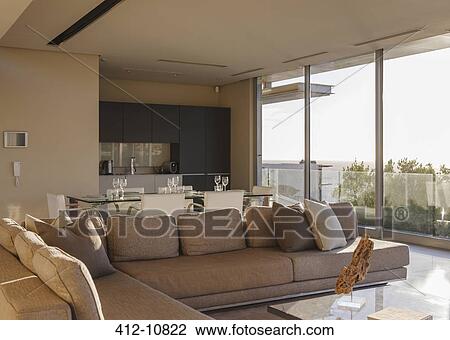 Sofa and dining table in modern living room View Large Photo Image Stock Image - Sofa and dining table in modern living room. Fotosearch