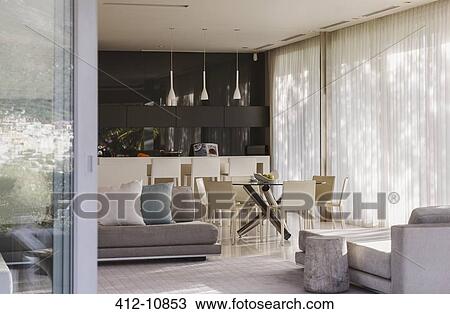 Sofa and dining table in modern living space View Large Photo Image Stock Image - Sofa and dining table in modern living space. Fotosearch