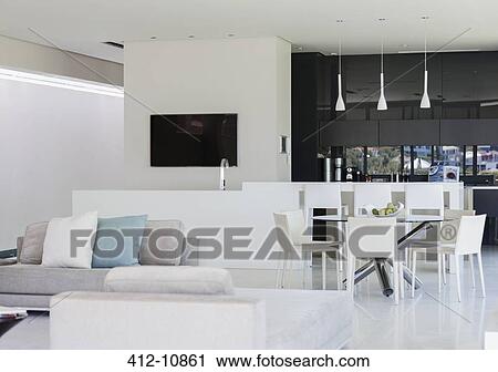 Sofa and dining table in modern living space View Large Photo Image Stock Image - Sofa and dining table in modern living space. Fotosearch