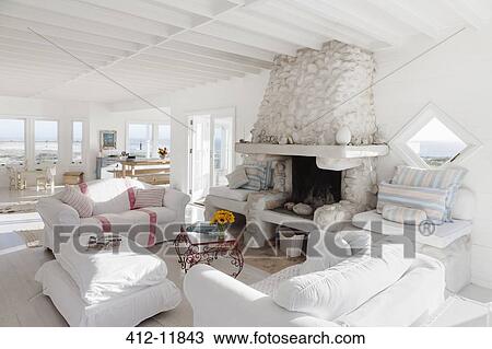 Sofas and fireplace in white living room View Large Photo Image Stock Image - Sofas and fireplace in white living room. Fotosearch