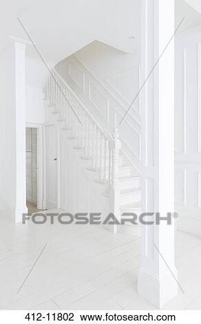 Stock Image - Staircase in white foyer. Fotosearch