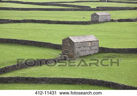 Stone buildings and walls in rural landscape View Large Photo Image Stock Image - Stone buildings and walls in rural landscape. Fotosearch