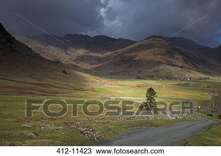 Storm clouds over rural hills View Large Photo Image Stock Image - Storm clouds over rural hills. Fotosearch