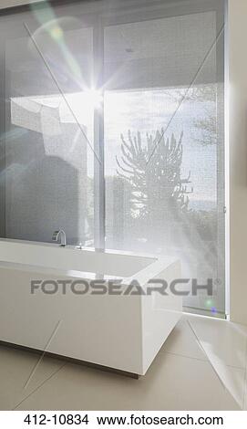 Sun shining through bathroom window View Large Photo Image Picture - Sun shining through bathroom window. Fotosearch